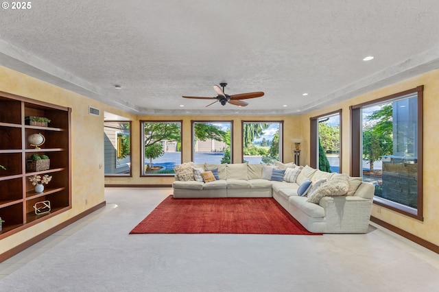6421 Brooklake Rd, Salem, OR 97305 - living area with a textured ceiling, baseboards, ceiling fan, recessed lighting, and built in shelves