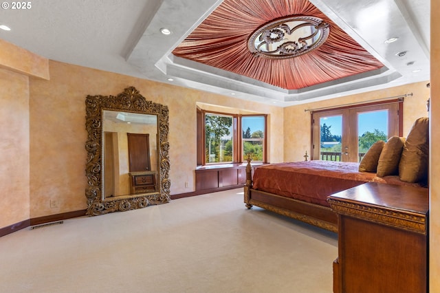 6421 Brooklake Rd, Salem, OR 97305 - carpeted bedroom featuring a raised ceiling, access to outside, french doors, recessed lighting, and multiple windows