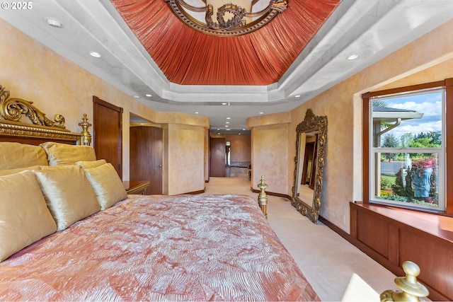6421 Brooklake Rd, Salem, OR 97305 - bedroom featuring light colored carpet, a tray ceiling, recessed lighting, and baseboards