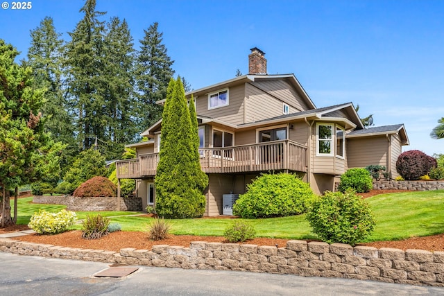 6421 Brooklake Rd, Salem, OR 97305 - rear view of house featuring a yard, a wooden deck, and a chimney