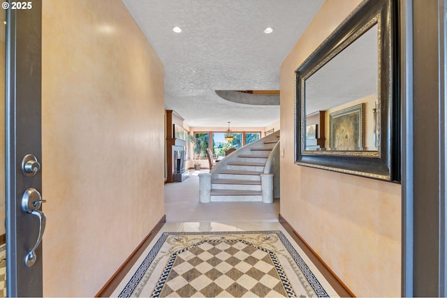 6421 Brooklake Rd, Salem, OR 97305 - corridor with baseboards, inlaid floor details, a textured ceiling, stairs, and recessed lighting