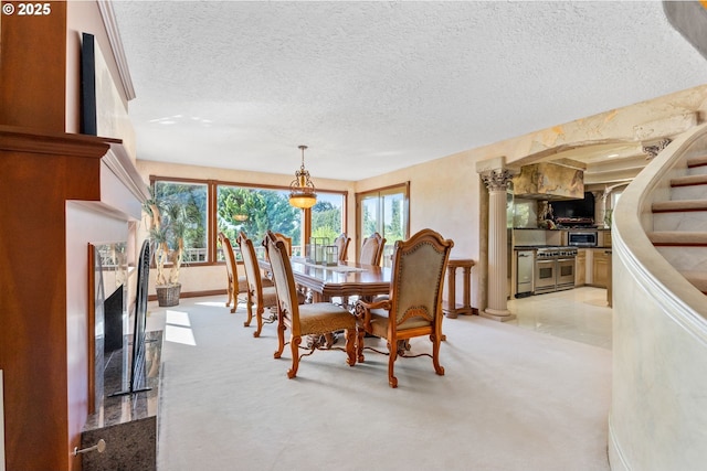 6421 Brooklake Rd, Salem, OR 97305 - dining space featuring a textured ceiling, light colored carpet, and baseboards