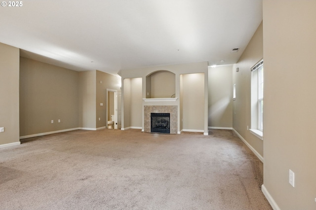 22864 SW Forest Creek Dr Unit 200, Sherwood, OR 97140 - unfurnished living room featuring baseboards, carpet floors, and a fireplace