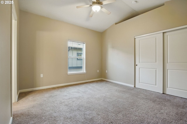 22864 SW Forest Creek Dr Unit 200, Sherwood, OR 97140 - unfurnished bedroom featuring a ceiling fan, a closet, baseboards, lofted ceiling, and carpet flooring