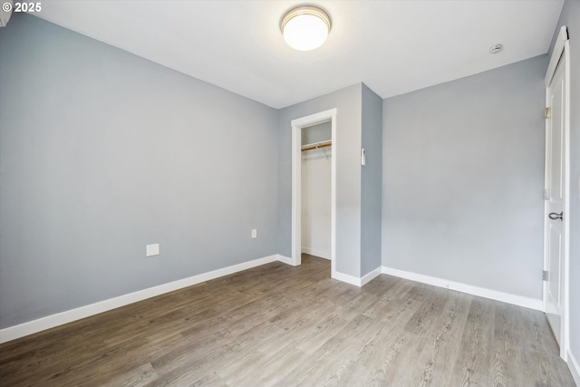 63 S 22nd St, Saint Helens, OR 97051 - unfurnished bedroom with wood finished floors, baseboards, and a closet