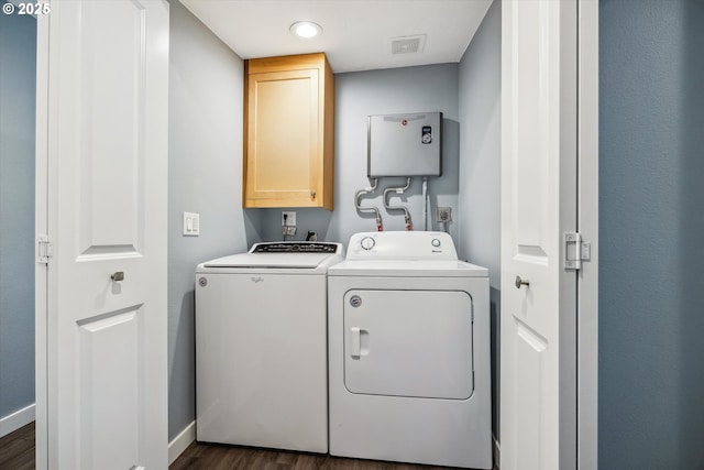 63 S 22nd St, Saint Helens, OR 97051 - laundry area with cabinet space, separate washer and dryer, baseboards, and dark wood-style flooring
