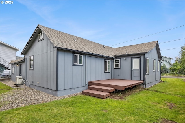 63 S 22nd St, Saint Helens, OR 97051 - back of property featuring a deck, roof with shingles, and a yard