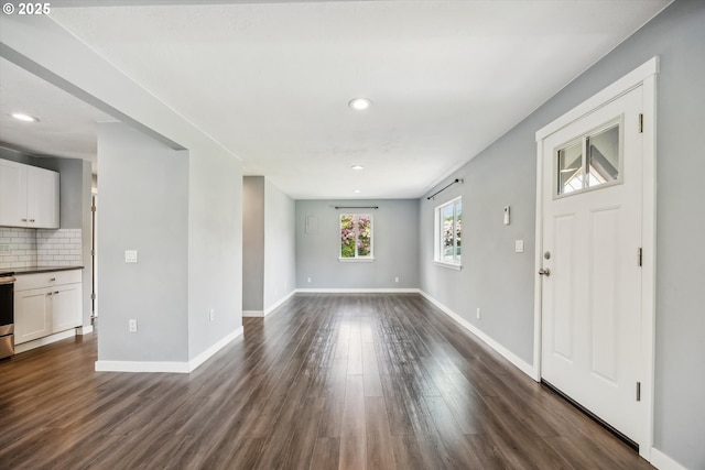 63 S 22nd St, Saint Helens, OR 97051 - unfurnished living room with dark wood-style floors, recessed lighting, and baseboards