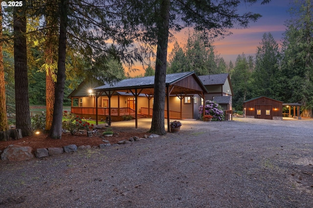 39100 SE Tumala Mountain Rd, Estacada, OR 97023 - view of front of property featuring gravel driveway, a garage, and metal roof