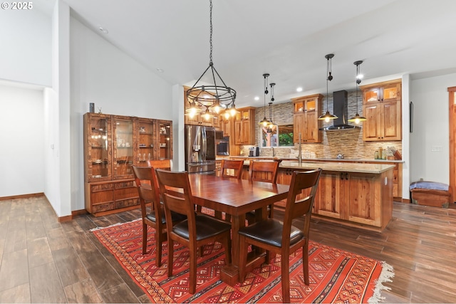 39100 SE Tumala Mountain Rd, Estacada, OR 97023 - dining area with dark wood-style flooring, a towering ceiling, recessed lighting, a chandelier, and baseboards