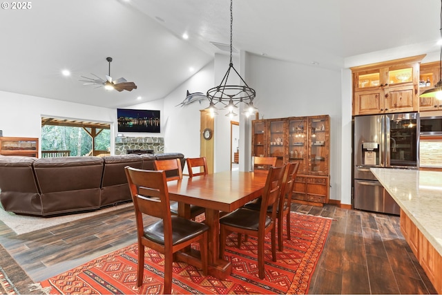 39100 SE Tumala Mountain Rd, Estacada, OR 97023 - dining space with a ceiling fan, dark wood-style flooring, a fireplace, recessed lighting, and high vaulted ceiling