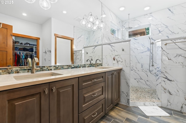 39100 SE Tumala Mountain Rd, Estacada, OR 97023 - full bathroom with double vanity, a marble finish shower, a walk in closet, recessed lighting, and backsplash