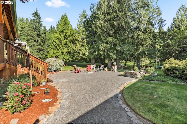 39100 SE Tumala Mountain Rd, Estacada, OR 97023 - view of home's community featuring a patio area, a fire pit, and a yard