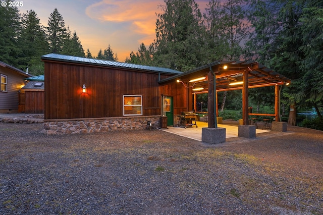 39100 SE Tumala Mountain Rd, Estacada, OR 97023 - rear view of house with metal roof and a patio area