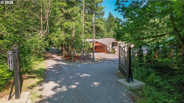 39100 SE Tumala Mountain Rd, Estacada, OR 97023 - view of dirt / gravel road featuring a gated entry and a forest view