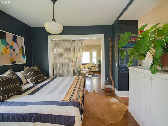 1236 N Emerson St, Portland, OR 97217 - bedroom featuring wood finished floors and baseboards