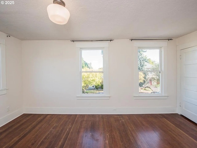 1236 N Emerson St, Portland, OR 97217 - unfurnished room with wood-type flooring, baseboards, and a textured ceiling