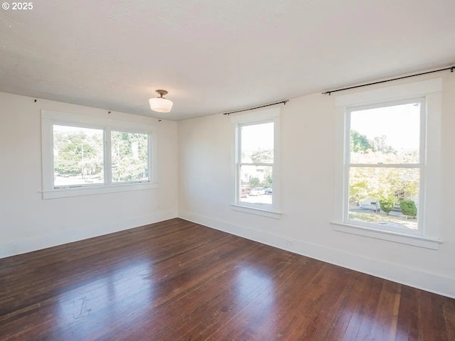 1236 N Emerson St, Portland, OR 97217 - spare room with dark wood finished floors and baseboards