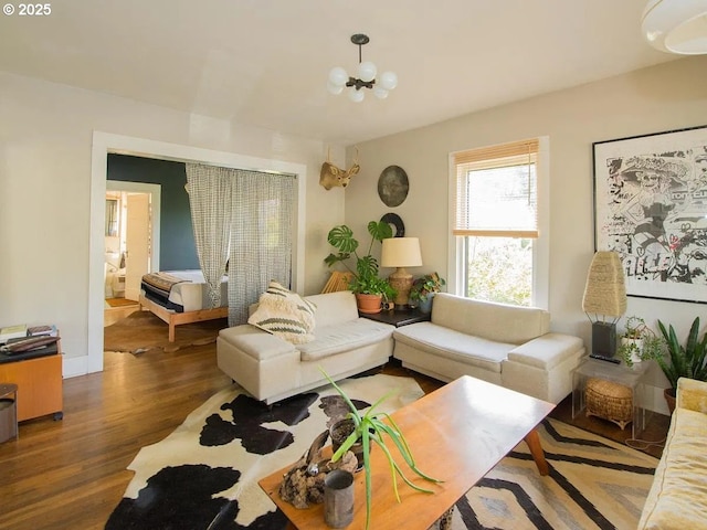 1236 N Emerson St, Portland, OR 97217 - living room with wood finished floors and a chandelier