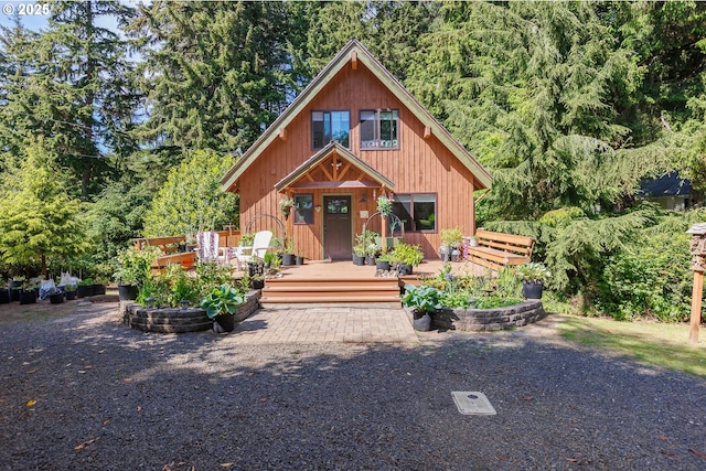 225 4th St, Otter Rock, OR 97369 - chalet / cabin with a deck and a view of trees