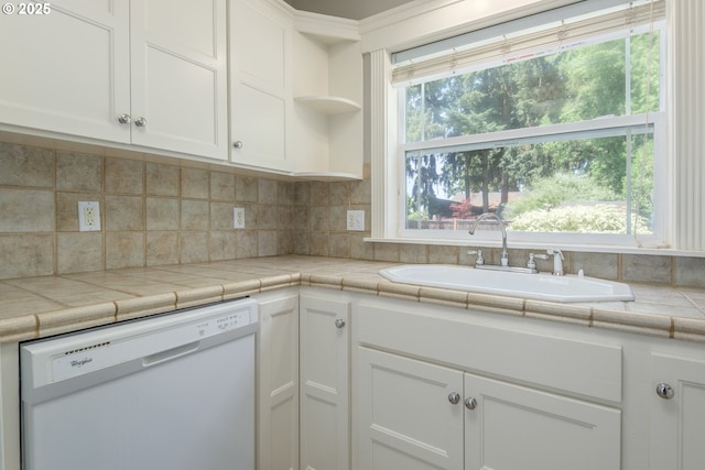 1507 Bogart Ln, Eugene, OR 97401 - kitchen featuring dishwasher, healthy amount of natural light, white cabinetry, and tasteful backsplash