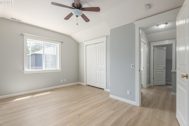 1507 Bogart Ln, Eugene, OR 97401 - unfurnished bedroom featuring light wood-style flooring, a closet, vaulted ceiling, and a ceiling fan