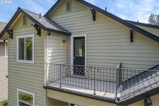 1507 Bogart Ln, Eugene, OR 97401 - view of side of home featuring a balcony and a shingled roof