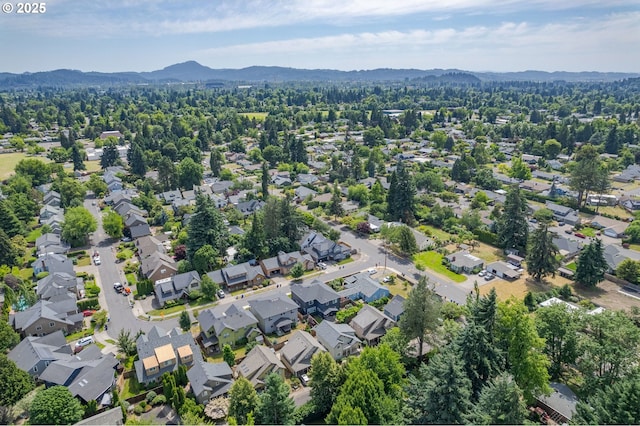 1507 Bogart Ln, Eugene, OR 97401 - aerial view of property and surrounding area featuring a mountain backdrop and nearby suburban area