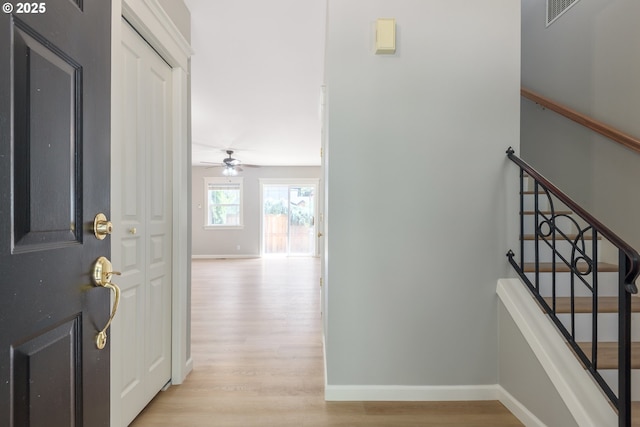 1507 Bogart Ln, Eugene, OR 97401 - entrance foyer with light wood finished floors, ceiling fan, and stairway