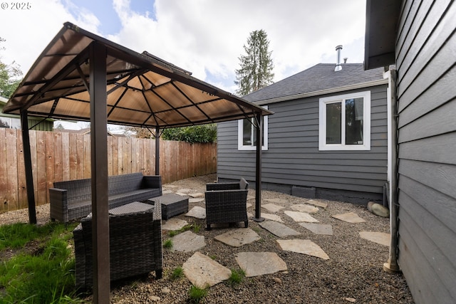 view of patio with a fenced backyard and a gazebo