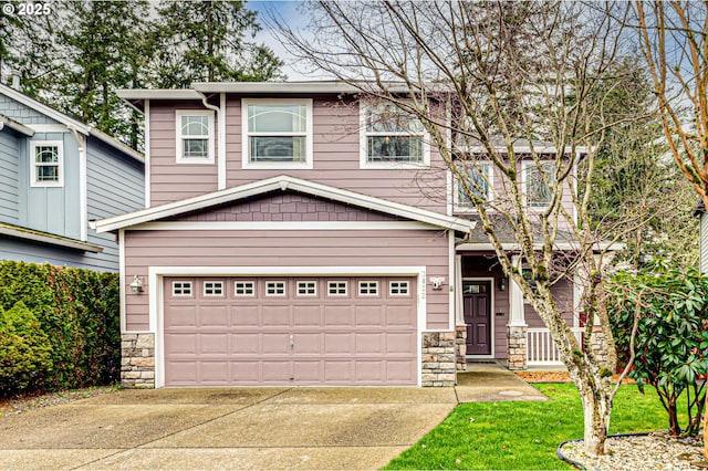 view of front of house featuring stone siding and concrete driveway