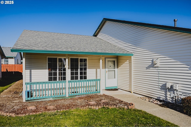 bungalow-style house featuring a porch and roof with shingles