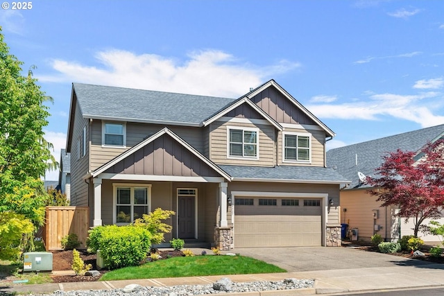 14727 Purple Ash Way, Oregon City, OR 97045 - craftsman house featuring roof with shingles, board and batten siding, an attached garage, driveway, and a porch