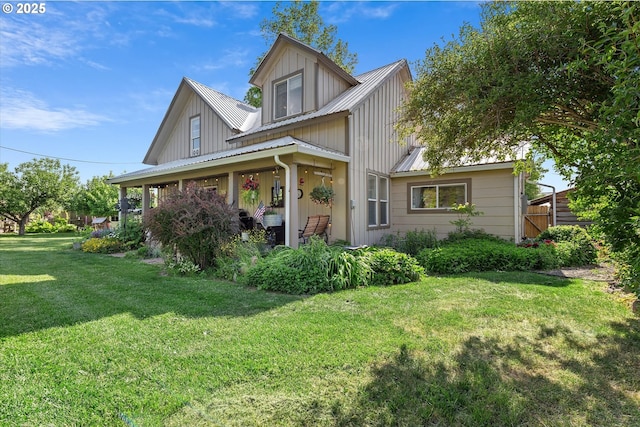 69768 Hwy 237, Cove, OR 97824 - view of front of property featuring a front yard, metal roof, board and batten siding, and covered porch