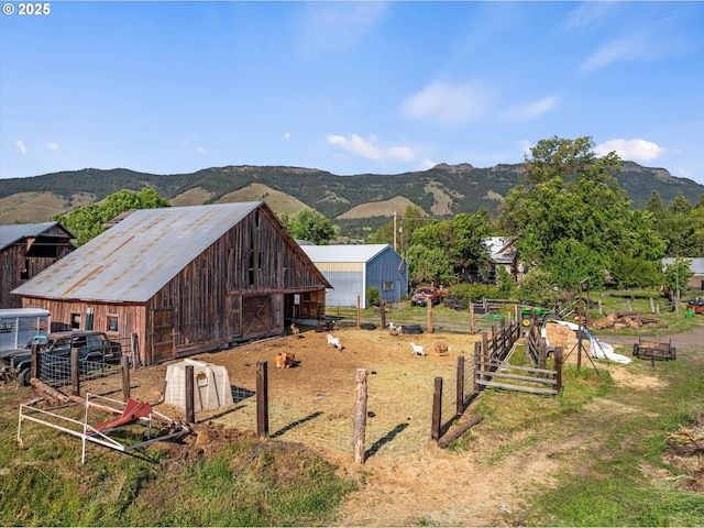 69768 Hwy 237, Cove, OR 97824 - view of side of home featuring a mountain view and an outdoor structure