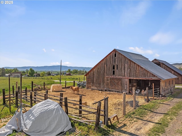 69768 Hwy 237, Cove, OR 97824 - view of outbuilding featuring an exterior structure, a mountain view, and a rural view