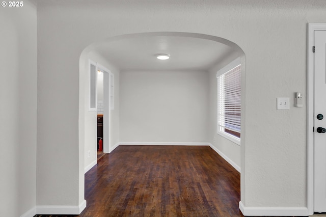 1119 7th St, Springfield, OR 97477 - hall featuring arched walkways, wood finished floors, and baseboards