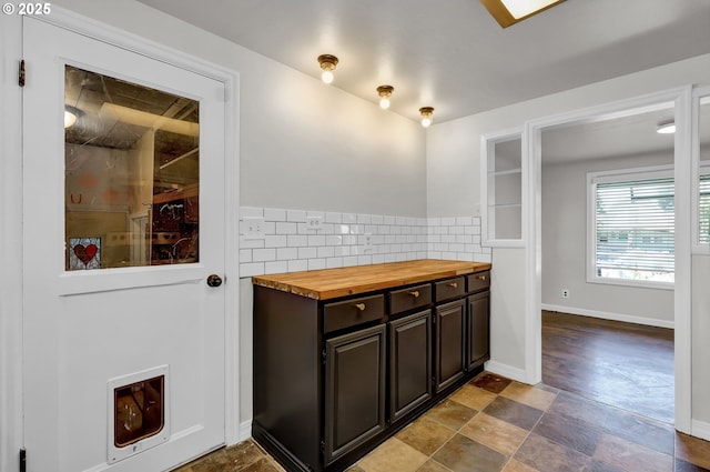 1119 7th St, Springfield, OR 97477 - bathroom featuring backsplash, stone finish flooring, and baseboards