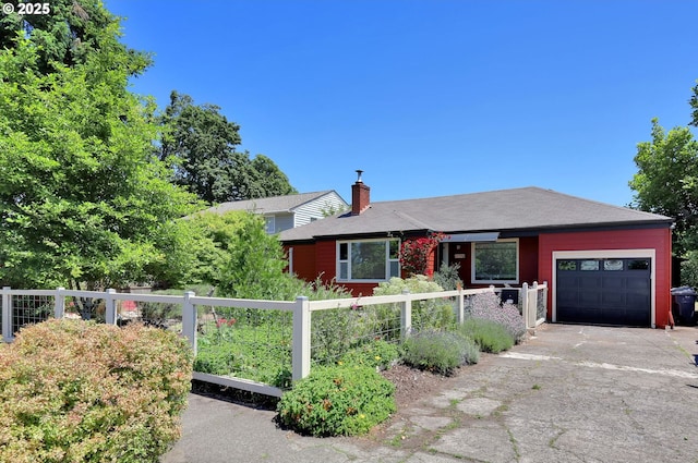 1119 7th St, Springfield, OR 97477 - view of front facade with an attached garage, a chimney, and asphalt driveway