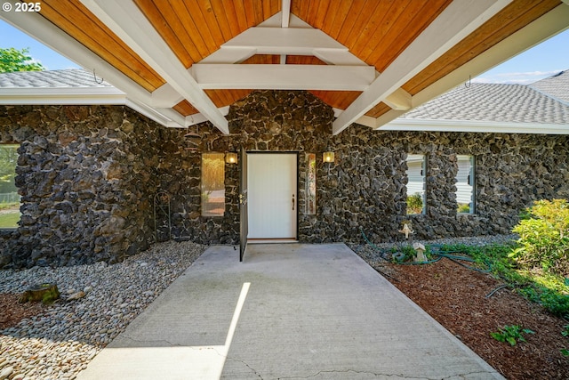 3794 E Nanitch Cir S, Salem, OR 97306 - doorway to property featuring stone siding, a patio area, and a shingled roof