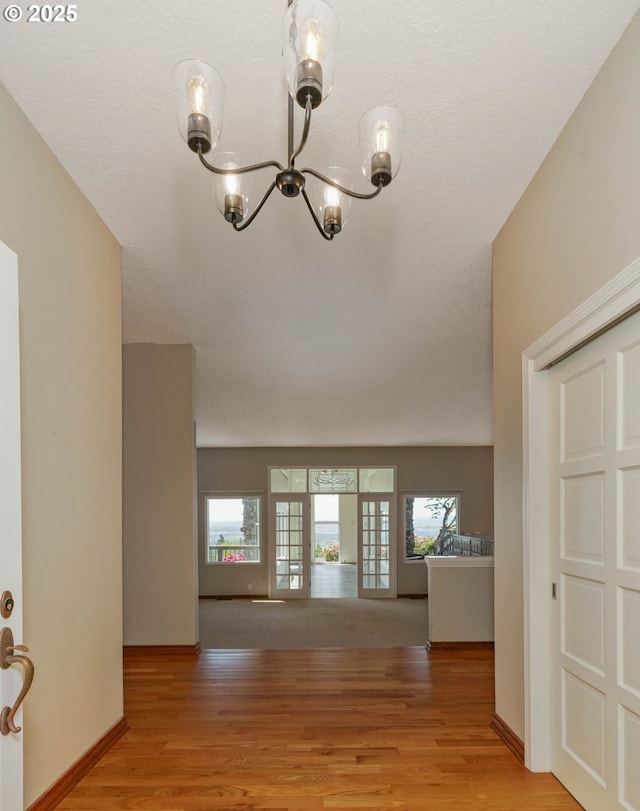 3794 E Nanitch Cir S, Salem, OR 97306 - entryway with a chandelier, light wood-type flooring, and baseboards