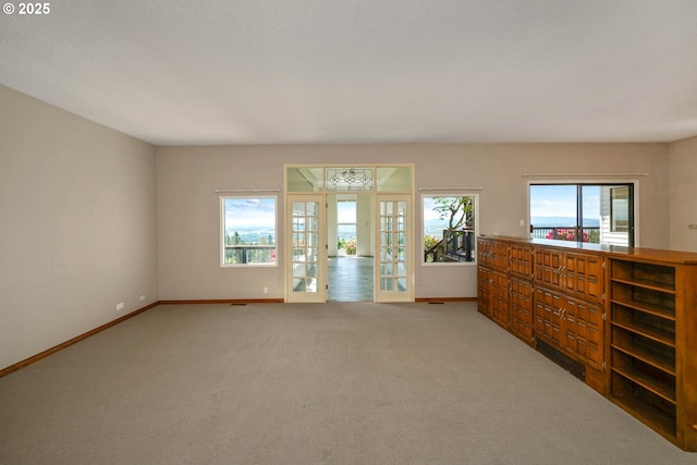 3794 E Nanitch Cir S, Salem, OR 97306 - empty room featuring baseboards, light carpet, and french doors