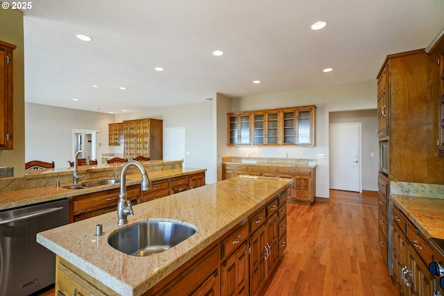 3794 E Nanitch Cir S, Salem, OR 97306 - kitchen featuring stainless steel dishwasher, a sink, recessed lighting, brown cabinetry, and glass insert cabinets