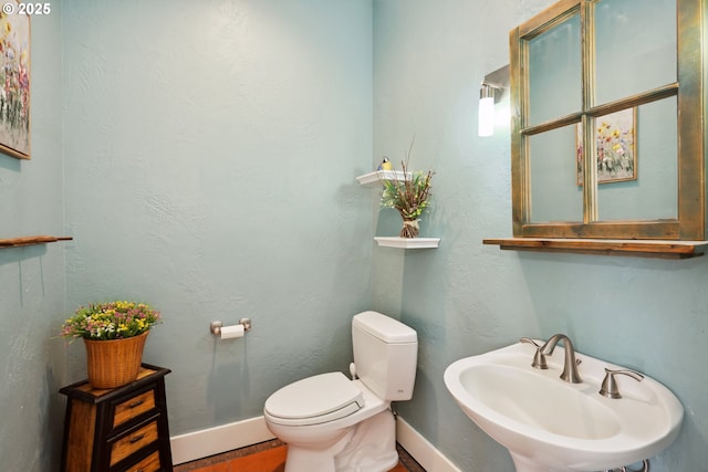 152 Palos Verdes, White Salmon, WA 98672 - half bathroom with a sink, baseboards, toilet, and wood finished floors