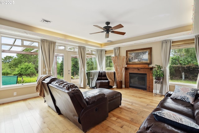 152 Palos Verdes, White Salmon, WA 98672 - living area with ceiling fan, a glass covered fireplace, light wood-style floors, and french doors