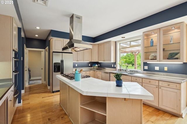 152 Palos Verdes, White Salmon, WA 98672 - kitchen with island exhaust hood, light brown cabinets, appliances with stainless steel finishes, open shelves, and recessed lighting