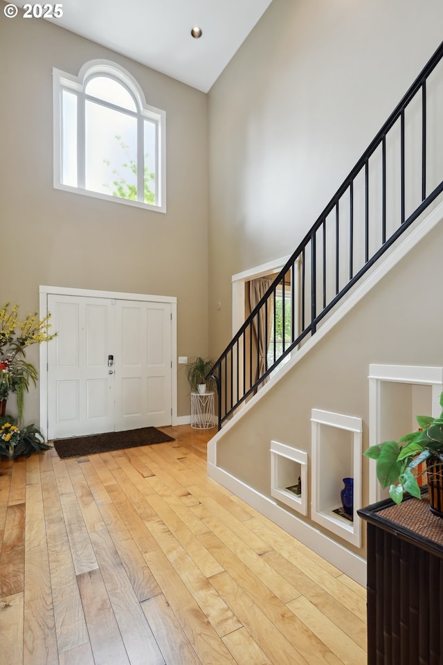 152 Palos Verdes, White Salmon, WA 98672 - entryway with a high ceiling, stairs, wood finished floors, baseboards, and recessed lighting