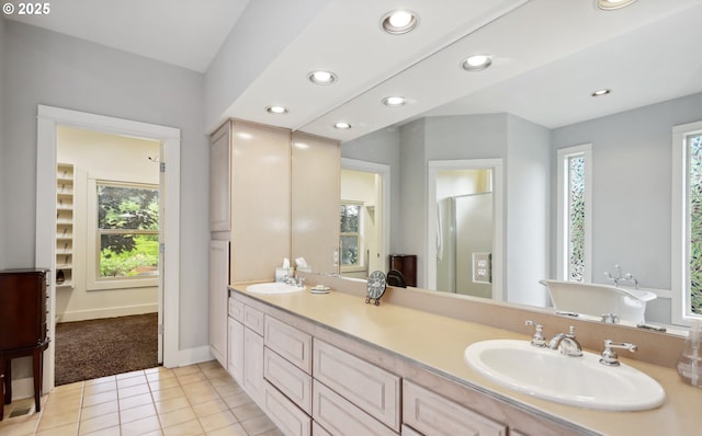 152 Palos Verdes, White Salmon, WA 98672 - full bathroom featuring tile patterned flooring, double vanity, a freestanding bath, recessed lighting, and baseboards