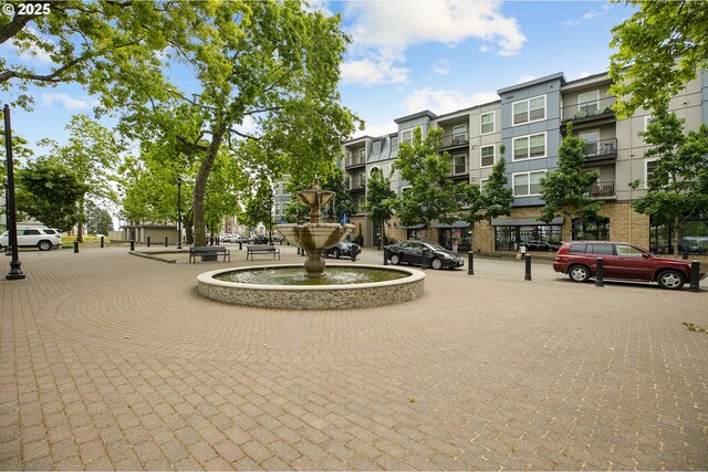 community pool featuring a patio area and fence