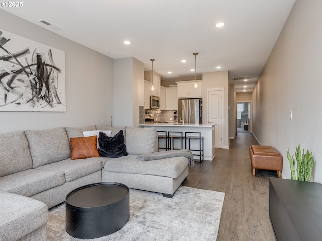 living room with light hardwood / wood-style floors